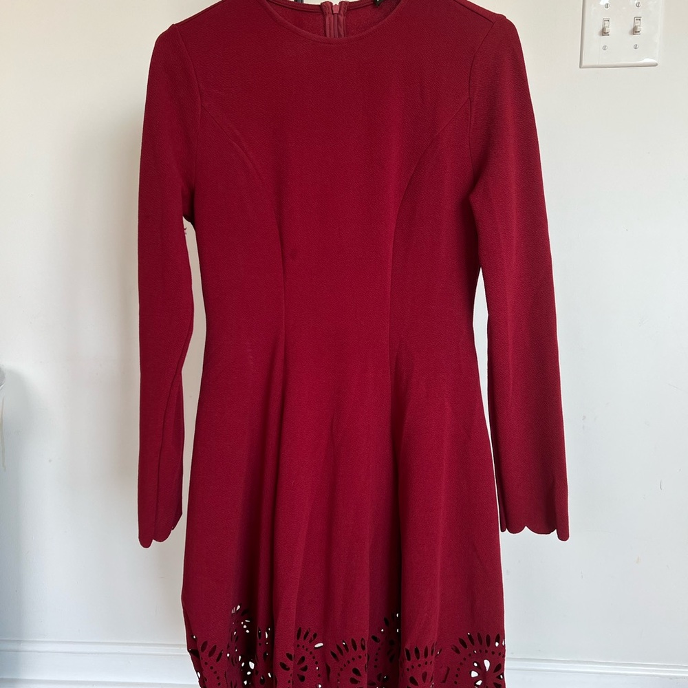 Red scoop neck dress with cut out at the bottom